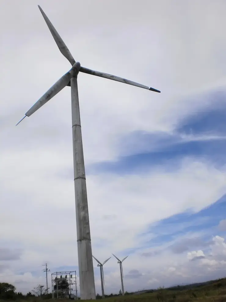 A wind turbine standing against the sky on the Ramakkalmedu ridge in Idukki