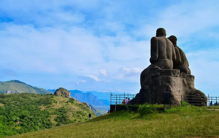 The giant Kuravan and Kurathi statue of a tribal couple standing on the windswept Ramakkalmedu ridge in Idukki, Kerala