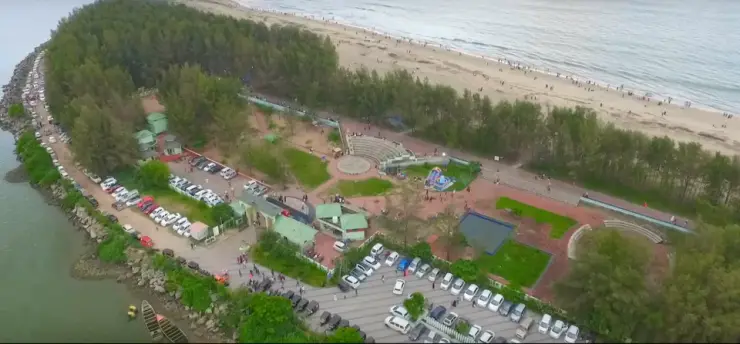 Aerial view of the Padinjarekkara sandspit, with the Arabian Sea on one side and the calm estuary water on the other