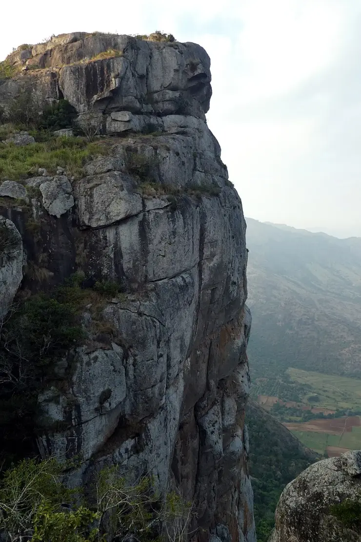 The sheer valley-side face of Ramakkal, a granite crag on the Ramakkalmedu ridge in Idukki, Kerala