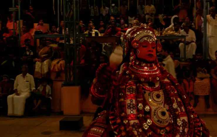A Theyyam performer in full costume, north Kerala