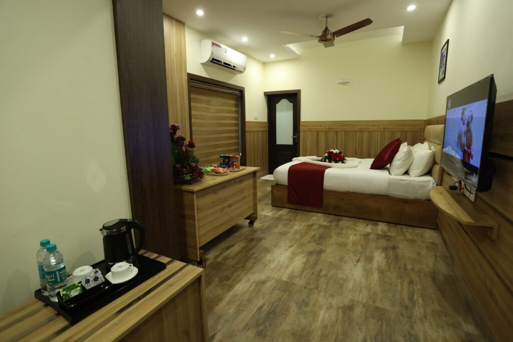 A guestroom pictured on Balaji Regency Kanhangad’s website; confirm the room category and current furnishings when booking.
