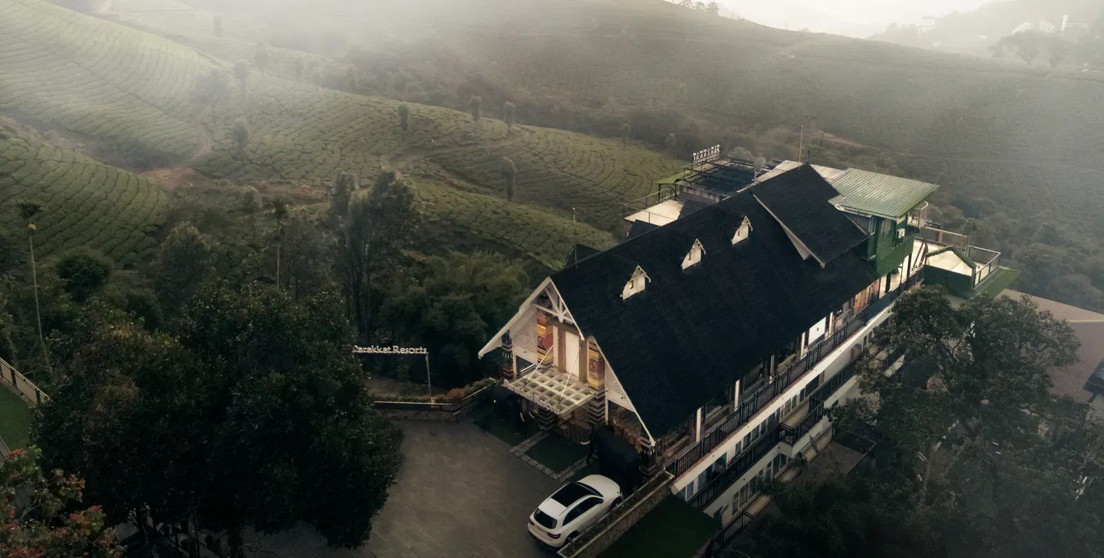 Parakkat Resorts building among tea slopes in Munnar
