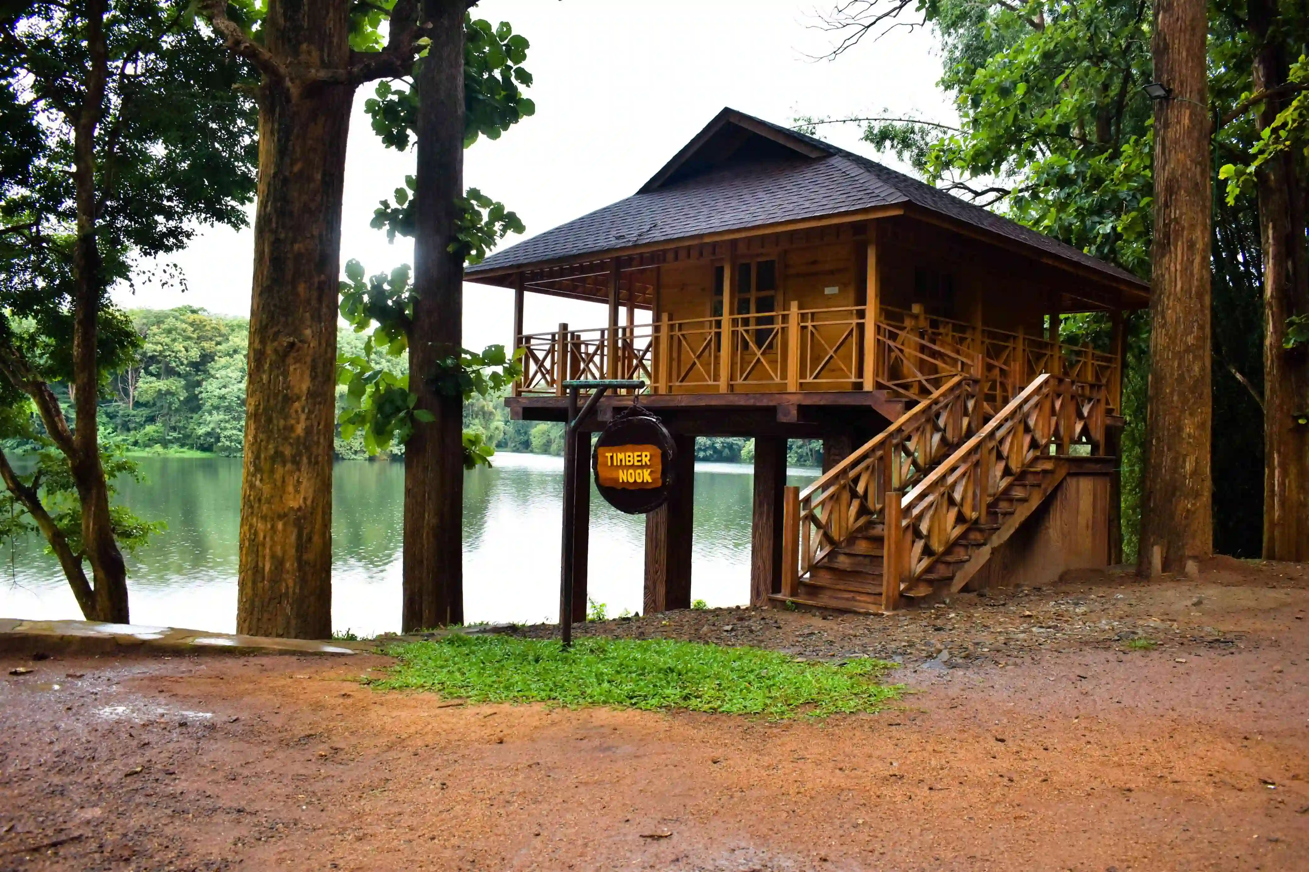 The named Timber Nook raised wooden cabin beside the reservoir in Parambikulam