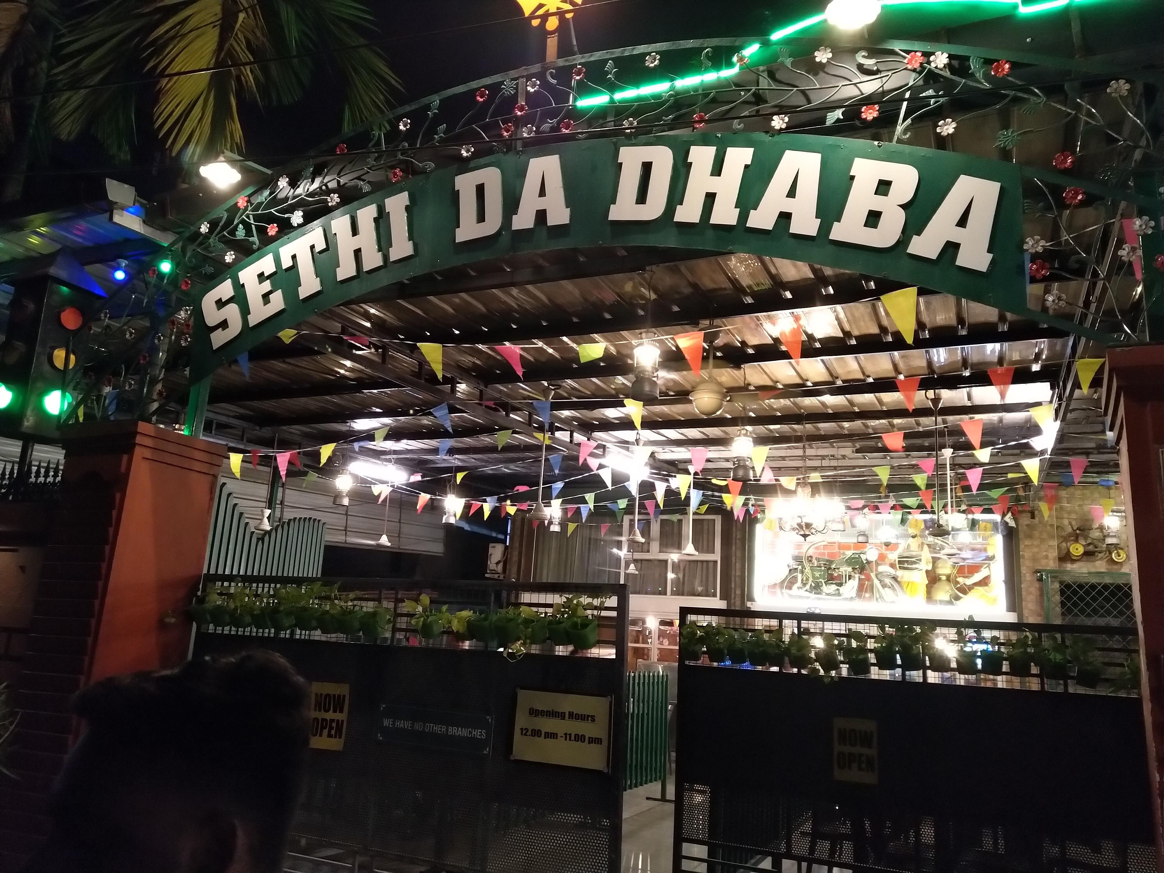Sethi Da Dhaba entrance at Kadavanthra, photographed at night.