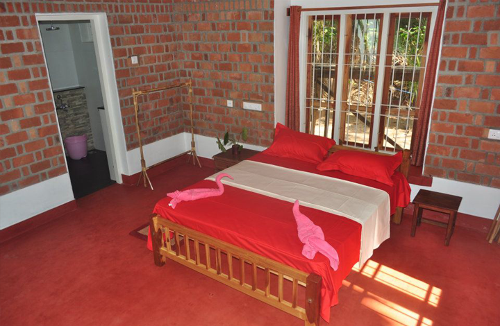 A Deluxe AC room published by Ashtamudi Villas; ask which room and view are available for the booking.