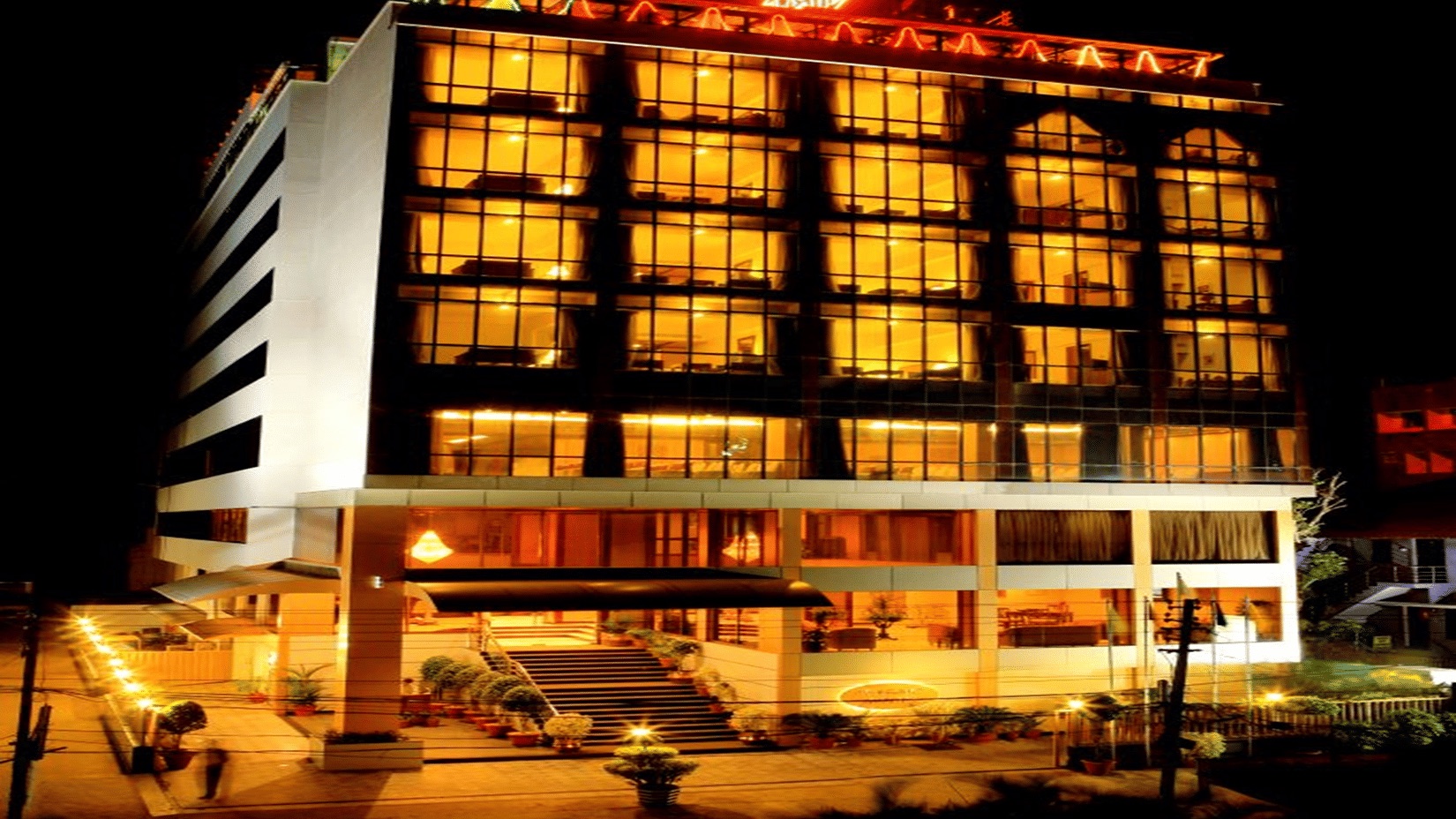 Classic Sarovar Portico's hotel facade on Manjalikulam Road, as published by the operator.
