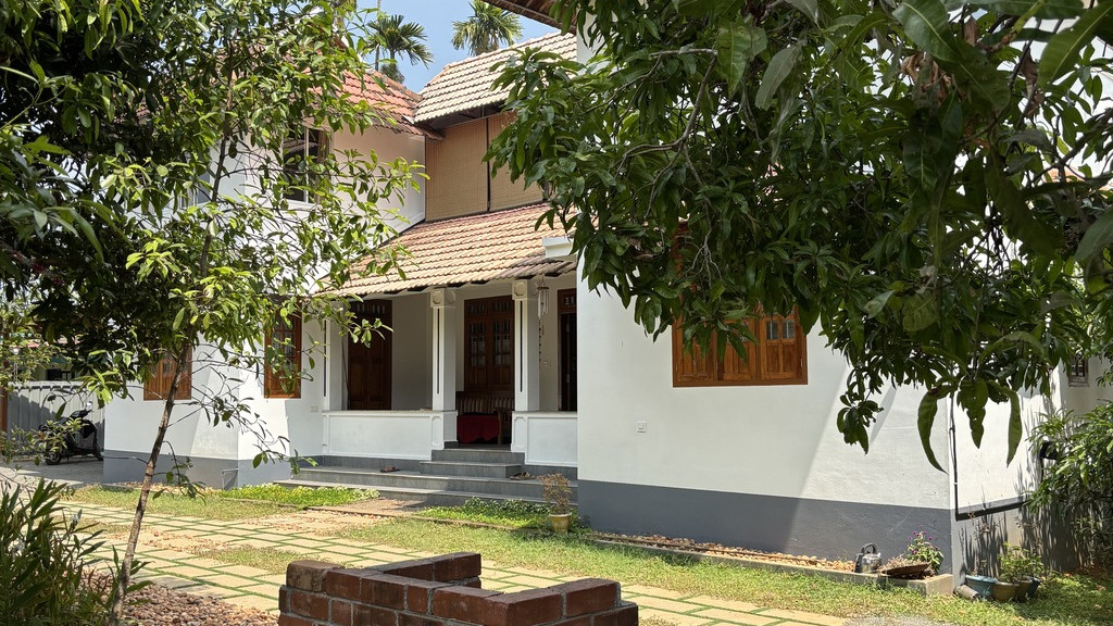 The Nedumudy homestay building shown on Good Friends Inn's Kerala Tourism listing.