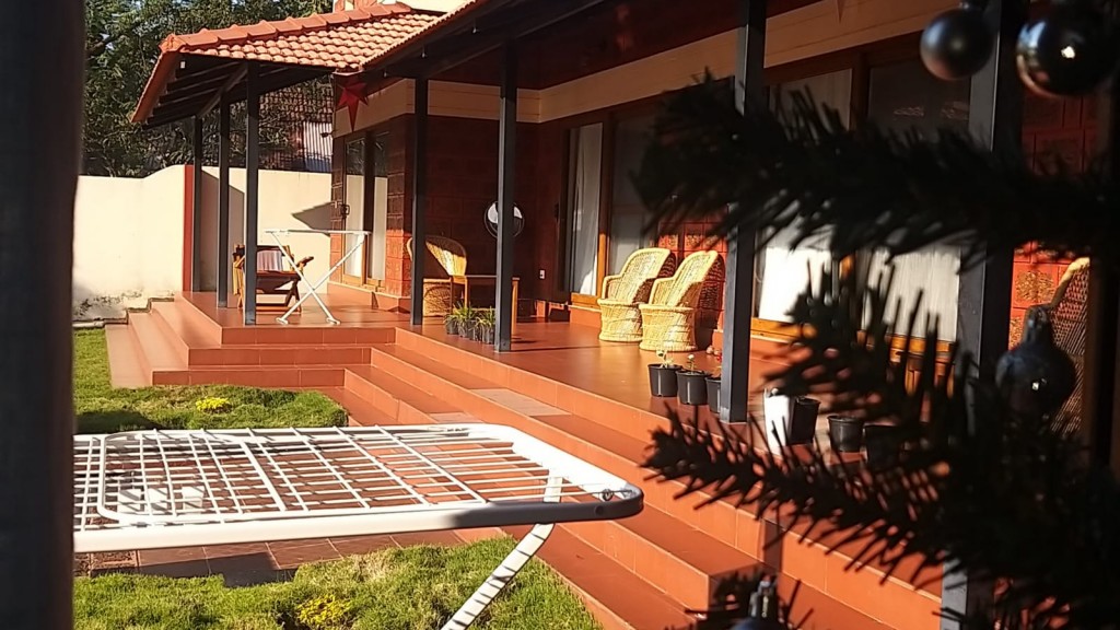 The Ixora's veranda and garden, as submitted to Kerala Tourism.