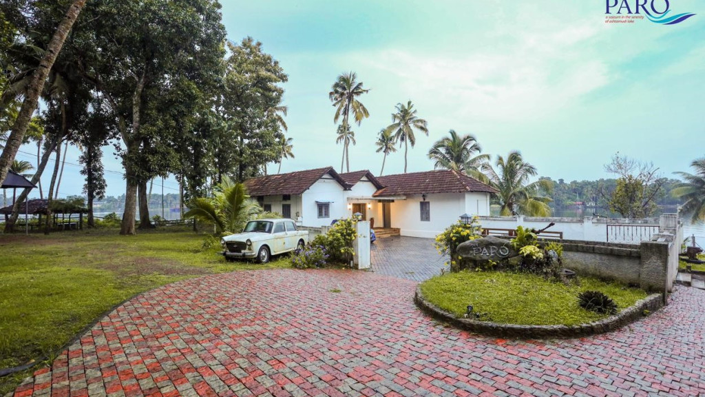 The Paro Homestay exterior at Kureepuzha, as supplied to Kerala Tourism. Confirm the current room and arrival route with the host.