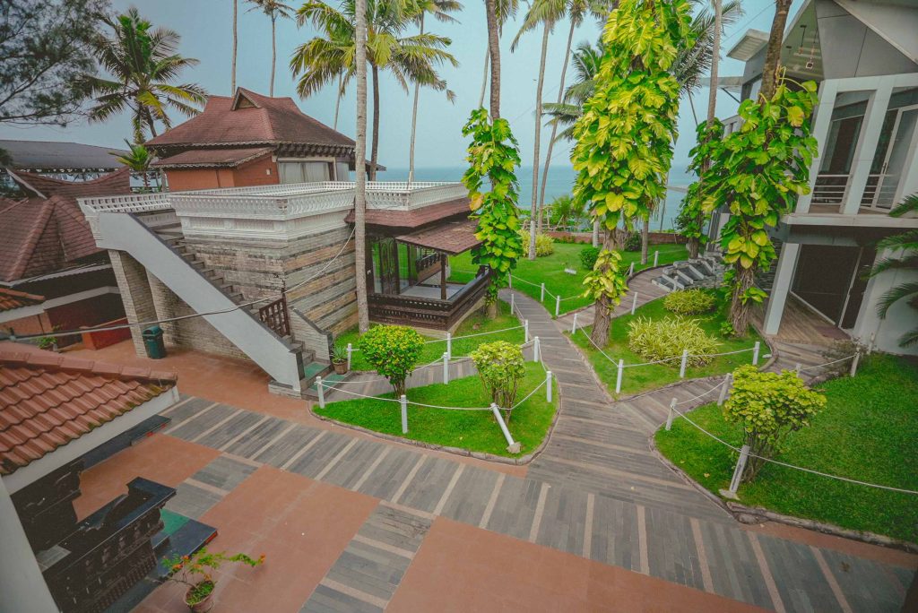 Akhil Beach Resort's coastal garden and accommodation buildings on its current website; confirm the specific room or unit.