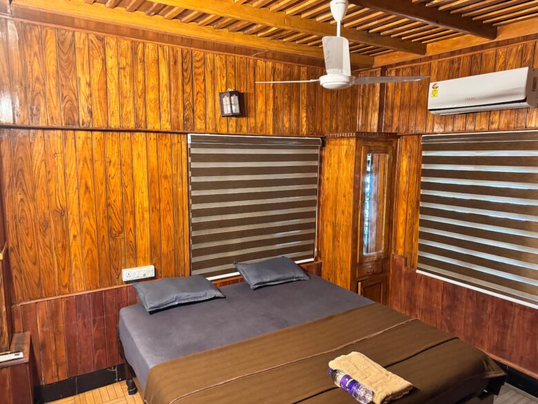 A wood-lined Moonwaves Beach Resort room shown on the operator website; confirm the room category before booking.