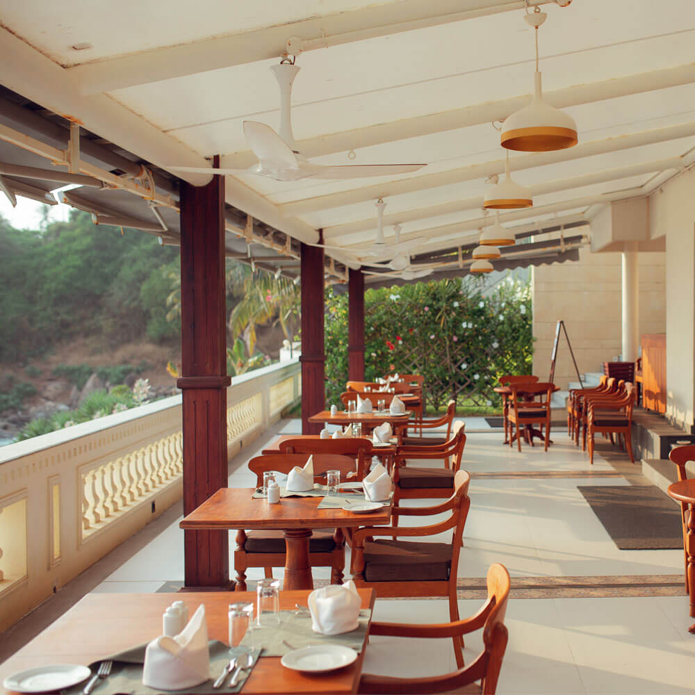 Naivedya's sea-facing restaurant terrace in an operator photograph uploaded in 2022; ask about its current setup.