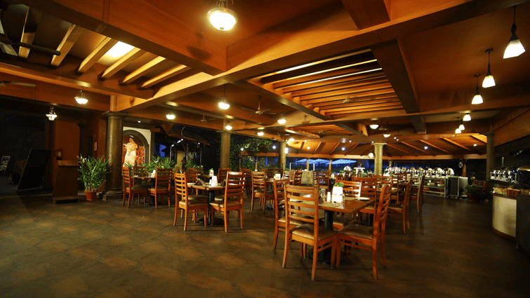 Tables, wooden ceiling and buffet counters at Southern Express, Uday Suites.