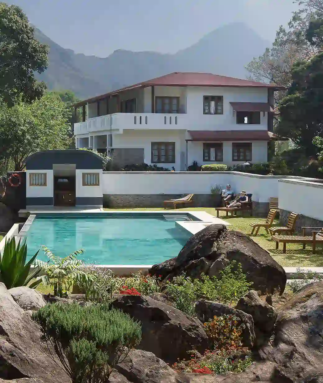 Pool, rocks and guest building at Windermere Estate, Pothamedu