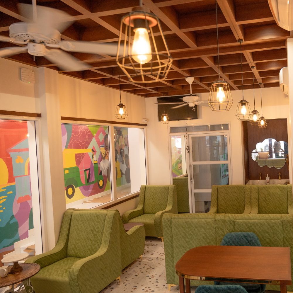 Interior seating published in The Lilly’s Stories operator gallery; confirm current dining tables and access directly. Photograph date not established.