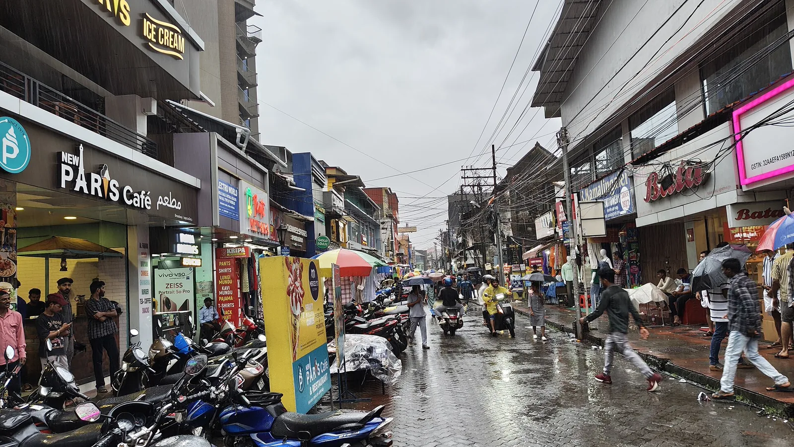 Shopfronts on Broadway, the pedestrianised market street in Ernakulam, Kochi