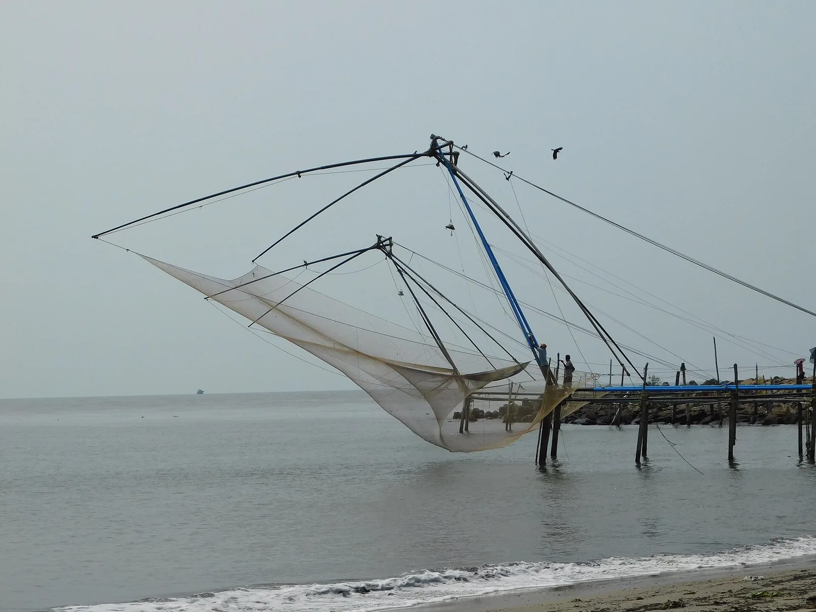 Cantilevered Chinese fishing nets on the Fort Kochi shore