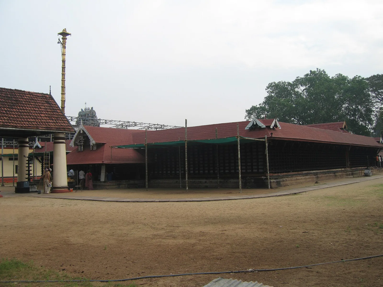 The outer wall, tiled roofs and golden flag mast of Ernakulathappan Temple, Ernakulam