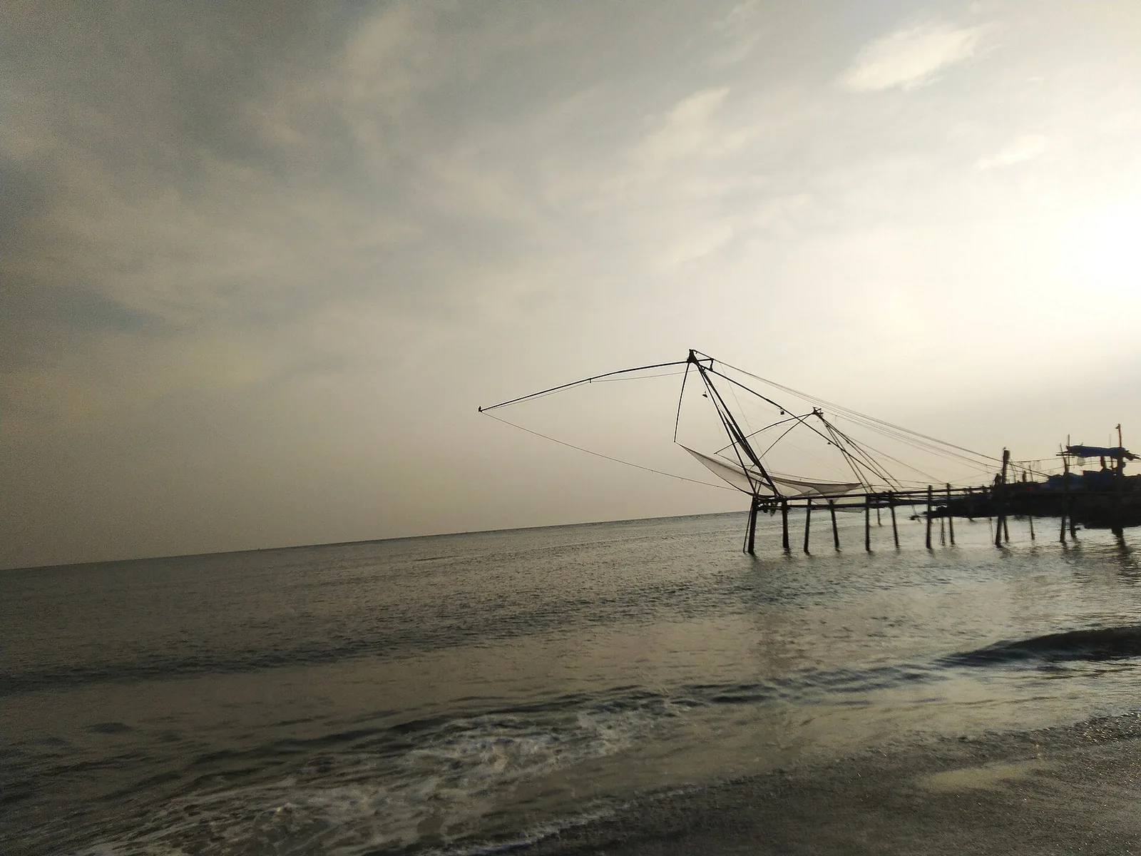 Chinese fishing nets on the estuary side at Munambam beach, Vypin