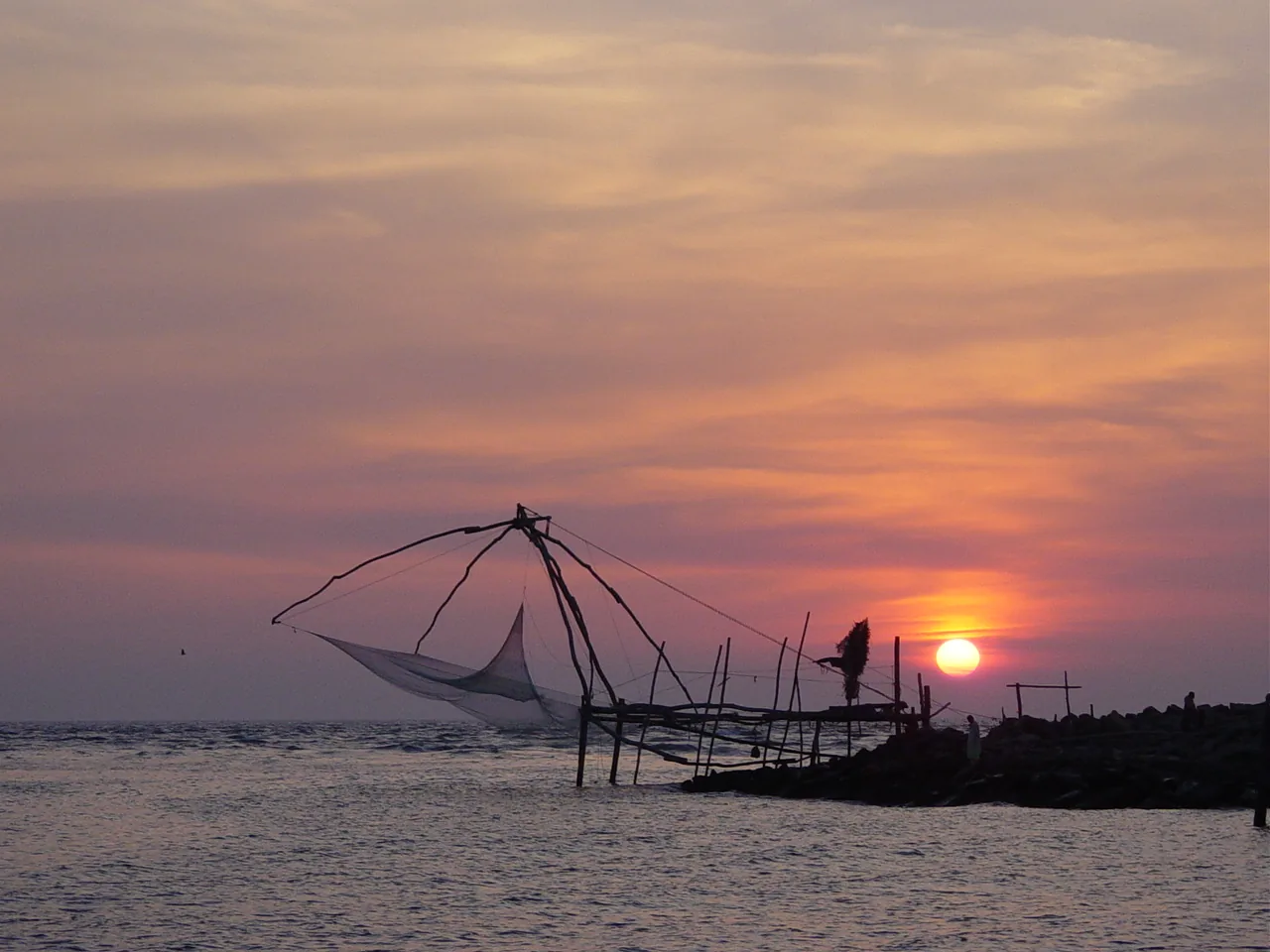 Sunset and a Chinese fishing net at Munambam beach, Vypin, Kochi