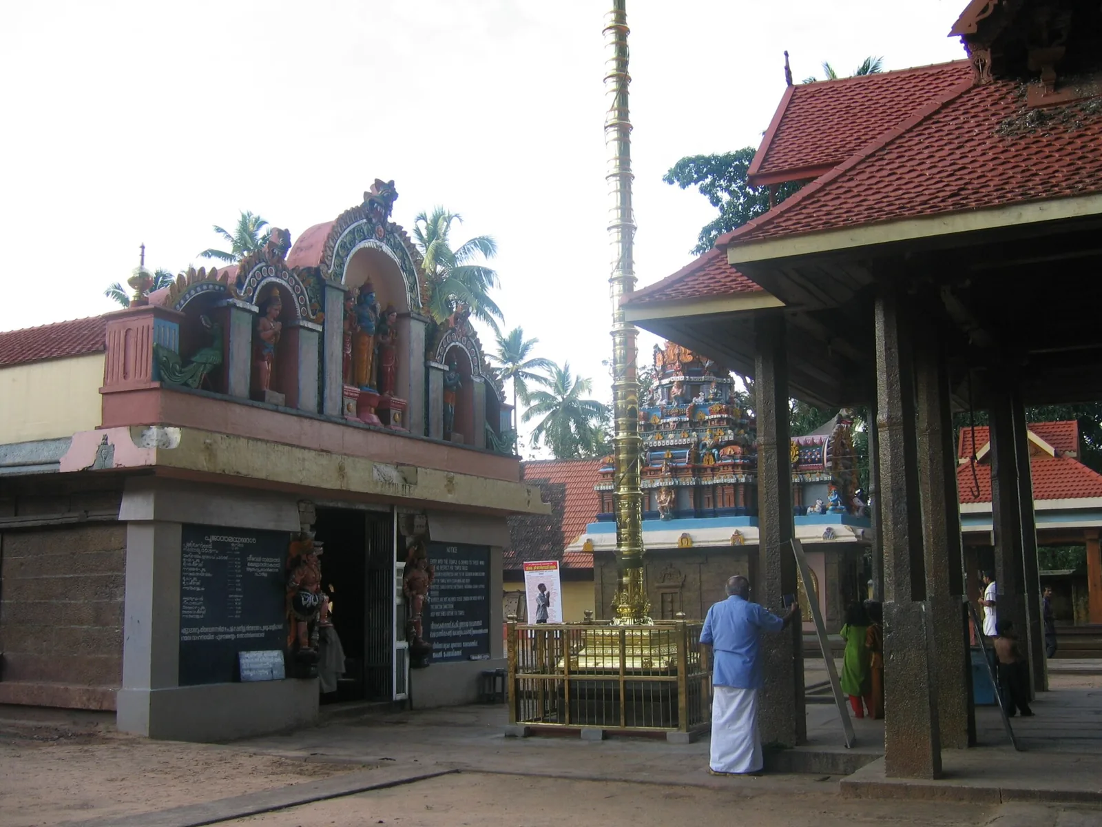 The inner courtyard of Janardanaswamy Temple, Varkala, with the gilded flagstaff and tiled mandapa