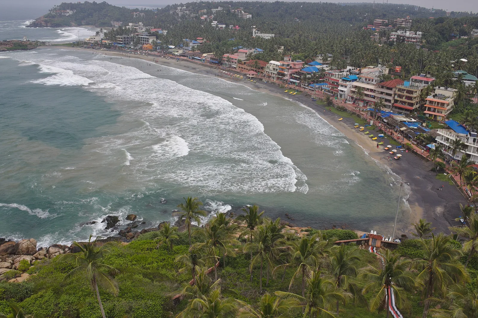 Lighthouse Beach at Kovalam seen from the striped lighthouse, with the crescent of sand below