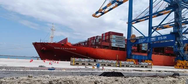 The container ship San Fernando alongside the quay at Vizhinjam International Seaport, with ship-to-shore cranes above it