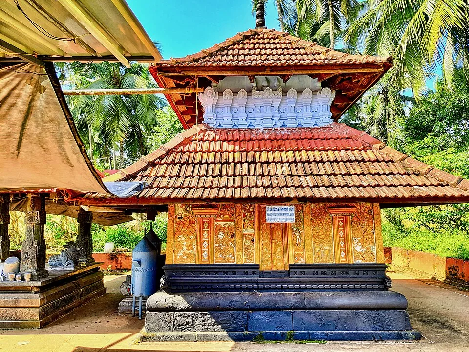 The Karanayil shrine at Triprangode with gilded doors under a two-tiered tiled roof