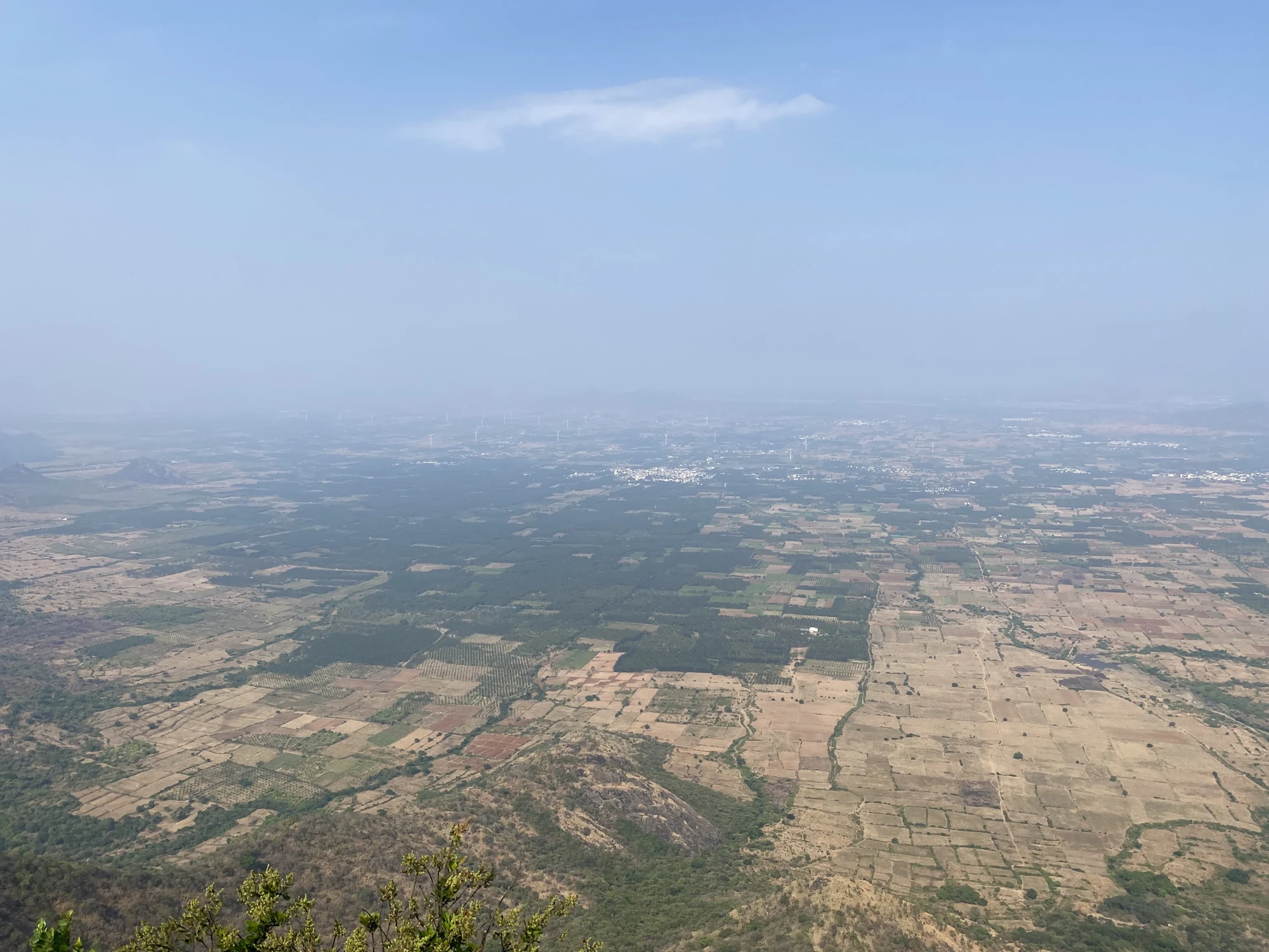 Rectangular fields, tree plantations and distant settlements across the lower country seen from Chathurangapara
