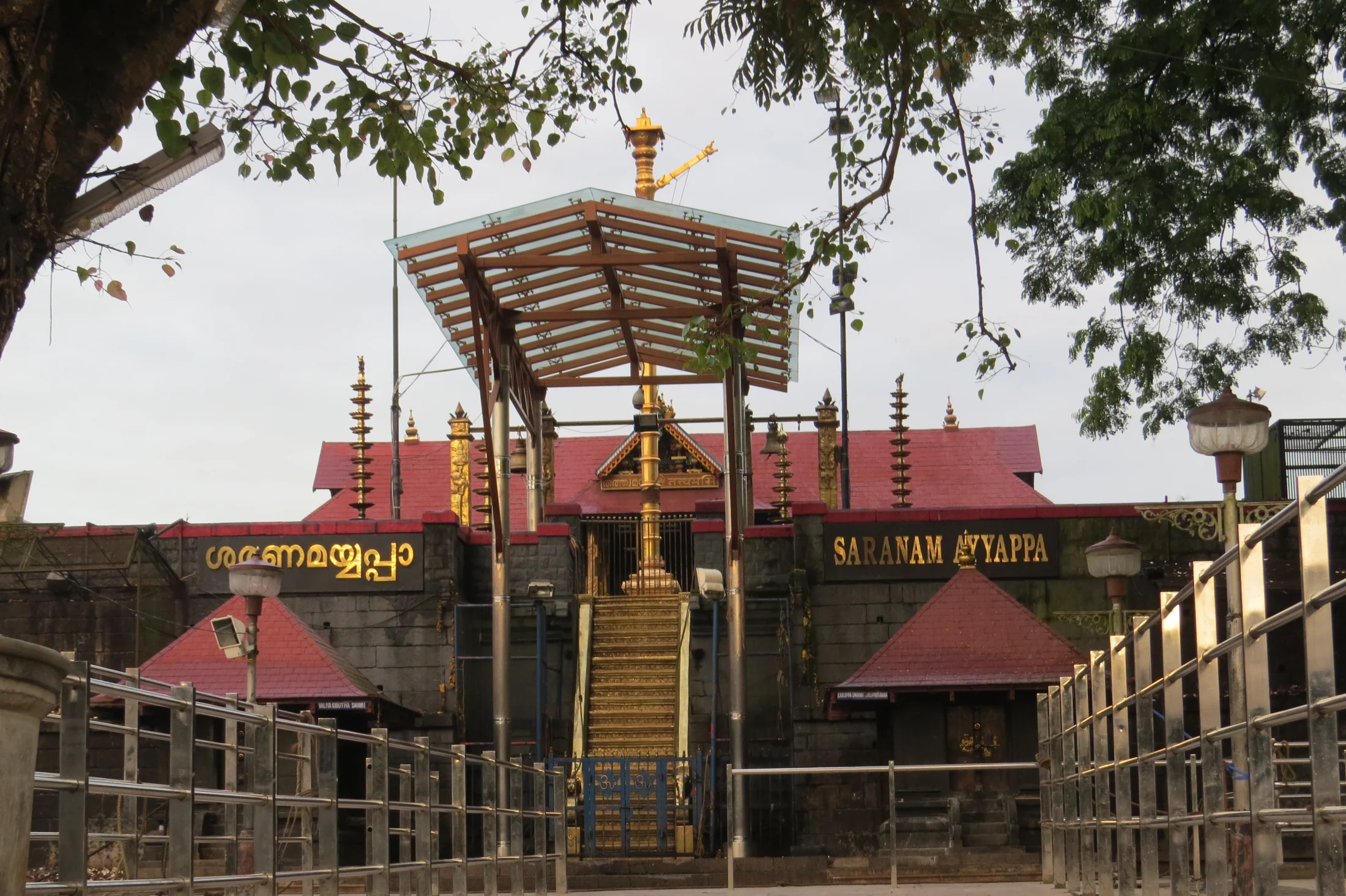 The eighteen sacred steps rise towards Sabarimala’s temple frontage, with the roofed shrine above.