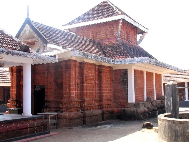 An older view of the Vadukunda shrine’s laterite walls and layered roofs.