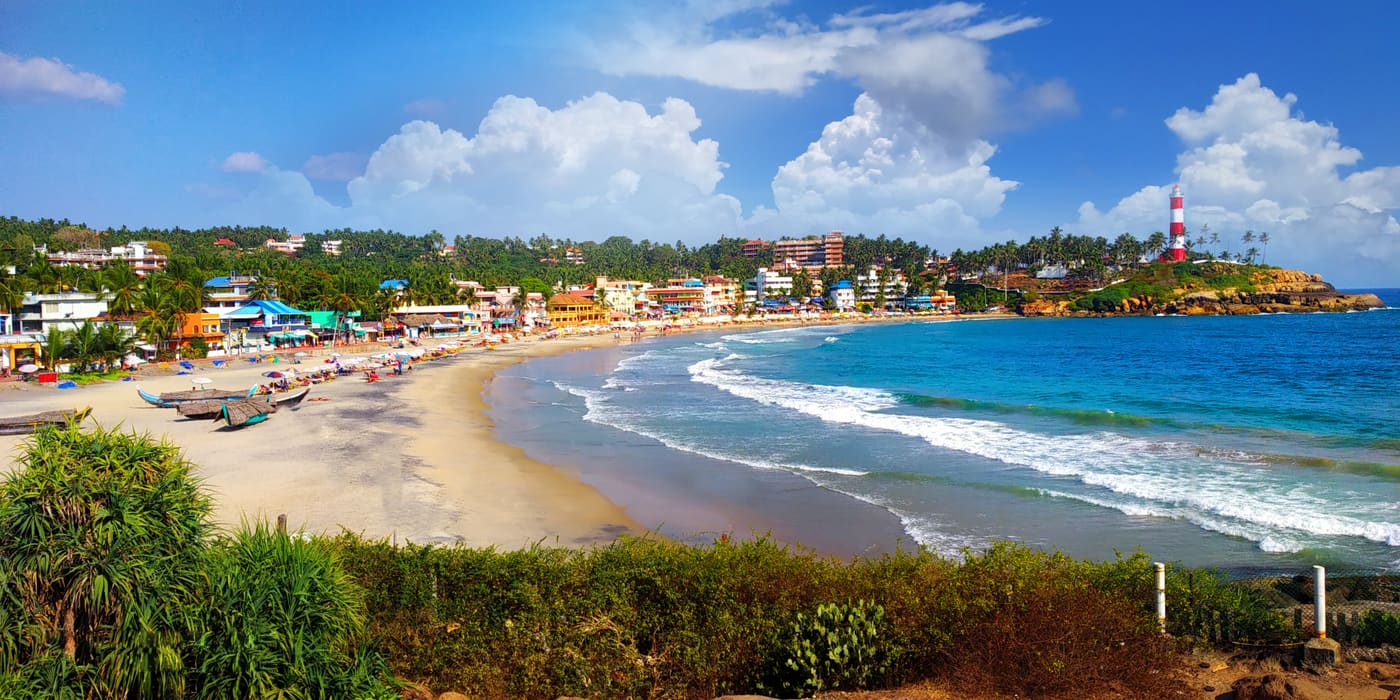 Crescent beach and lighthouse at Kovalam, Kerala